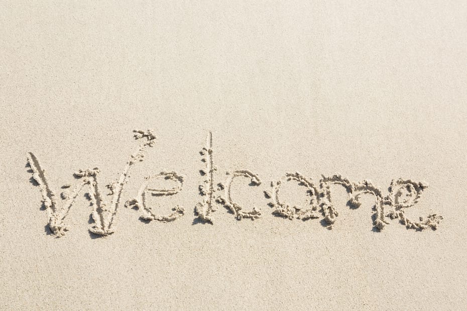 Welcome written in sand